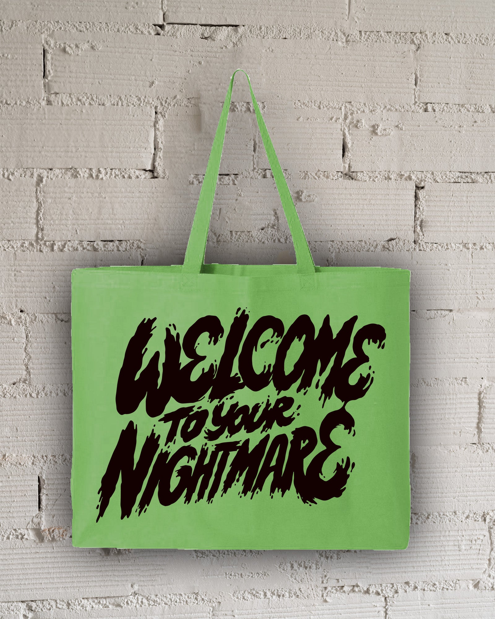 Lime Green tote bag featuring black text that reads Welcome to Your Nightmare in a horror-style font.